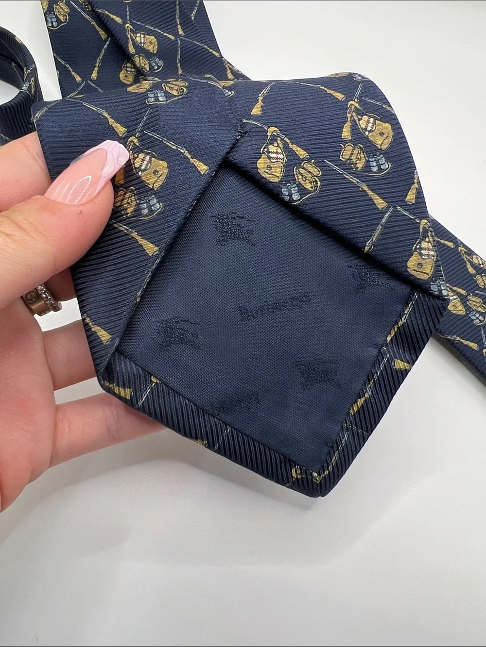502. Burberrys Navy Tie with Gold Crest Pattern